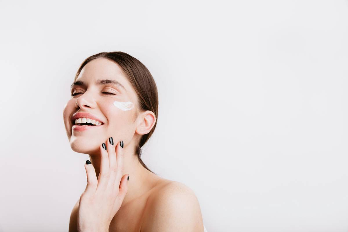Close-up of smooth, evenly toned forearm skin with visible healthy luminosity, illustrating the body glow glowing skin routine a in action